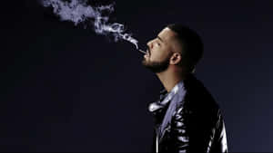 Drake Smokes A Cigarette In Black Leather Jacket Wallpaper