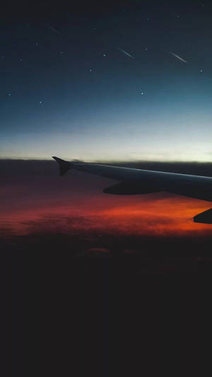 Dramatic Orange Clouds With Airplane Iphone Wallpaper