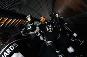 Drew Doughty Hands Up To High Five Teammate Mike Richards Wallpaper