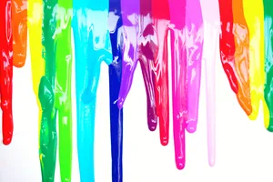 Dripping Rainbow Paint On A Colorful Background Wallpaper