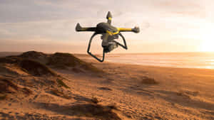 Drone Flight Over Beachat Sunset Wallpaper