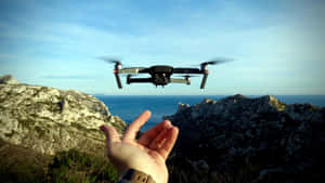 Drone Flight Over Mountainous Terrain Wallpaper