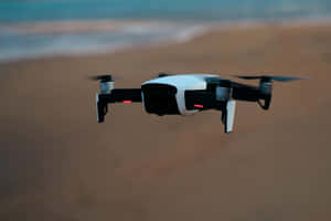 Drone In Flight Over Beach Wallpaper