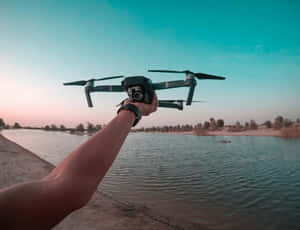 Drone Readyfor Takeoffat Lakeside Wallpaper