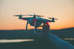 Drone Readyfor Takeoffat Sunset Wallpaper