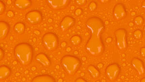 Droplets On An Orange Background Wallpaper