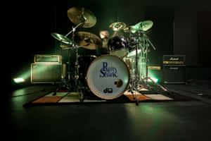 Drum Set On Stage With Lighting Wallpaper