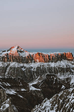 Dusk Over The Snowy Mountain Landscape On Iphone Wallpaper