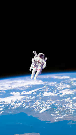 Earth's Surface With A Floating Astronaut Iphone Wallpaper