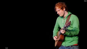 Ed Sheeran In Green Jacket Wallpaper