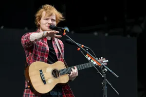 Ed Sheeran In Red Flannel Shirt Wallpaper