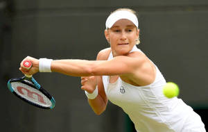 Ekaterina Makarova In Action On The Tennis Court. Wallpaper