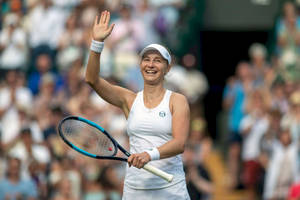 Ekaterina Makarova On The Tennis Court Waving To The Crowd Wallpaper