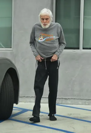 Elderly Man Casual Outfit Standing Wallpaper