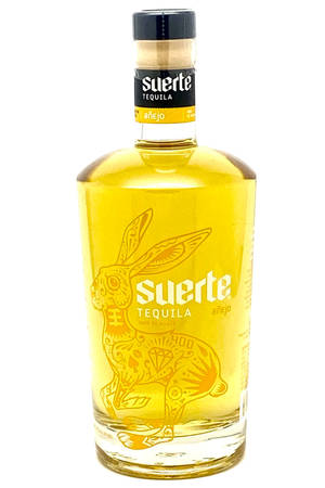 Elegance In A Bottle - Suerte Tequila Anejo Gold Wallpaper