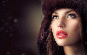 Elegance Redefined: Female Model In Fur Hat Wallpaper