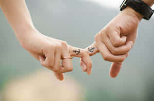 Elegant Anchor Couple Hand Tattoo Wallpaper