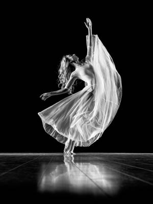 Elegant Ballet Dancer In Action Wallpaper