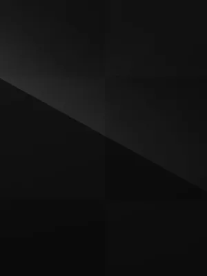 Elegant Black Ipad Showcasing A Sophisticated Black And Gray Checkered Pattern Wallpaper Wallpaper