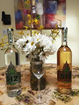 Elegant Bottle Of Tequila 512 With Distinctive Grey And Yellow Label Wallpaper