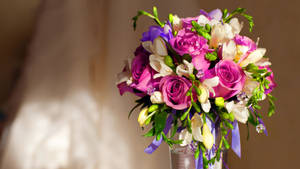 Elegant Bouquet In Crystal Vase Wallpaper