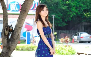 Elegant Chinese Girl In Traditional Attire Wallpaper