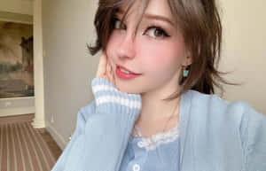 Elegant Portraitin Blue Cardigan Wallpaper