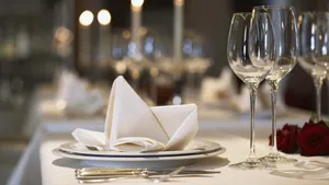 Elegant Table Setting In A High-end Restaurant Wallpaper