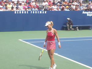 Elena Dementieva On Tennis Field Wallpaper