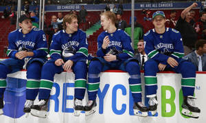 Elias Pettersson With Canucks Teammates Wallpaper