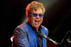 Elton John Blue Suit Concert Wallpaper