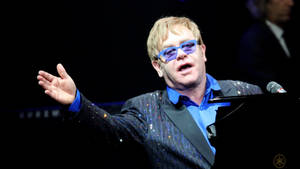 Elton John Concert Hand Wave Wallpaper