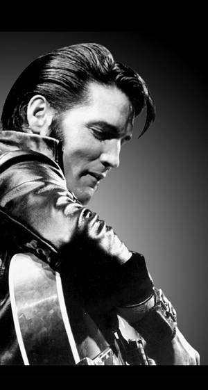 Elvis Presley Playing A Guitar Wallpaper
