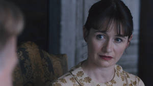Emily Mortimer Exhibiting A Confused Expression Wallpaper