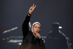 Eminem In Stage Peace Sign Wallpaper