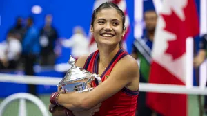 Emma Raducanu Holding Her Championship Trophy Wallpaper