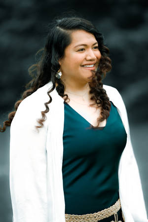 Empowered Plus-size Woman Enjoying The Wind In Her Hair Wallpaper