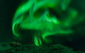 Enchanting Dance Of The Aurora Borealis Wallpaper