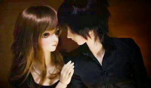 Enchanting Doll Couple Embracing Love Wallpaper