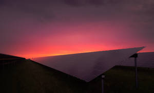 Energy Panels Under A Rosy Sky Wallpaper