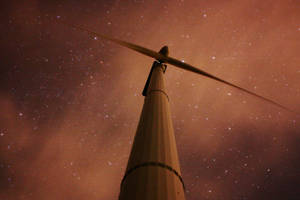 Energy Windmill Under Night Sky Wallpaper