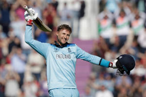 England Cricketer Joe Root In A Moment Of Triumph Wallpaper