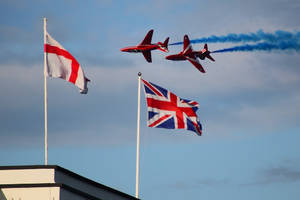 England Flag With Jet Plane Wallpaper