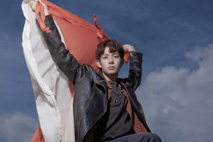 Enhypen Member Heeseung With Cloth Flag Wallpaper