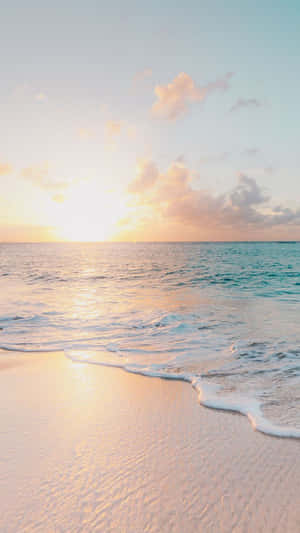 Enjoy A Beautiful Sunset At Pastel Beach Wallpaper