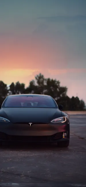 Enjoy A Wireless World With The Tesla Iphone. Wallpaper