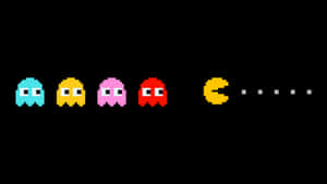 Enjoy Classic Arcade Gaming With Hd Pacman Wallpaper