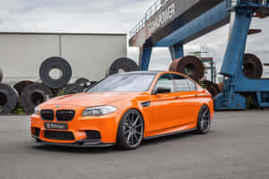 Enjoy Driving In Style With The Bmw M5 Wallpaper