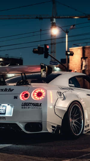 Enjoy Life In Style With The Nissan Skyline For Iphone Wallpaper