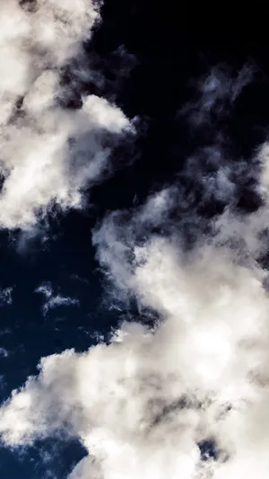Enjoy The Beauty Of A Sky Full Of Clouds Wallpaper